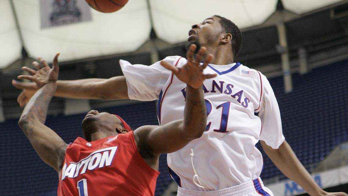 Kansas’ Markieff Morris, right, knocks the ball away from Dayton’s London Warren (1) during a second-round men’s NCAA college basketball tournament game Sunday, March 22, 2009, in Minneapolis. (AP Photo/Jim Mone)