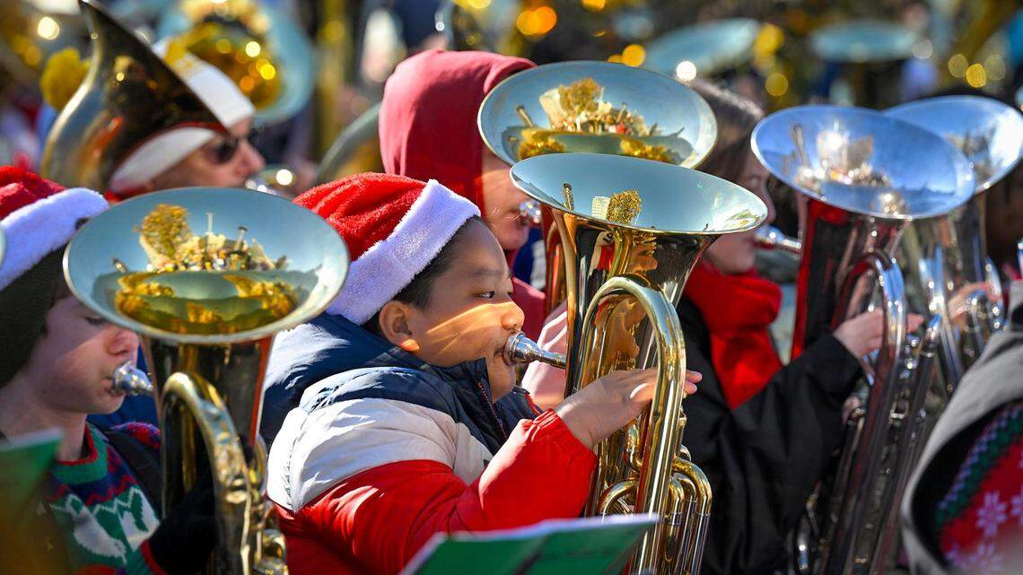 Decked out in their holiday finery, hundreds of local tuba and euphonium players gathered Tuesday, Dec. 5, 2023, in the Crown Center Square for their annual TubaChristmas holiday concert.