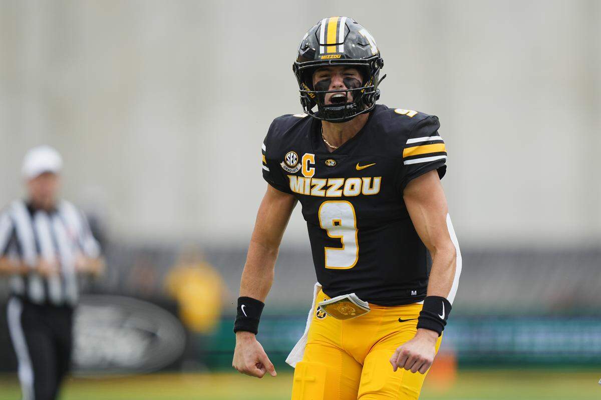 Missouri Tigers quarterback Beau Pribula (9) celebrates after a run against the Alabama Crimson Tide during the first half of the game at Faurot Field at Memorial Stadium on Oct. 11, 2025.