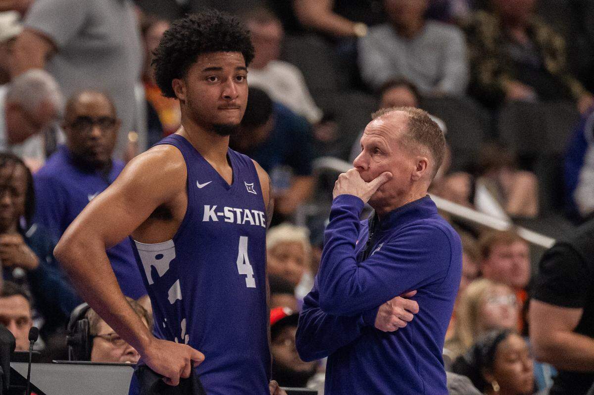 Kansas State Wildcats head coach Matthew Driscoll talks with Kansas State Wildcats guard PJ Haggerty (4) late in the second half of the Wildcats first round game vs. the BYU Cougars in the Big 12 Men's Basketball Tournament, on Tuesday, March 10, 2026, at T-Mobile Center. The Wildcats lost to BYU, 105-91.