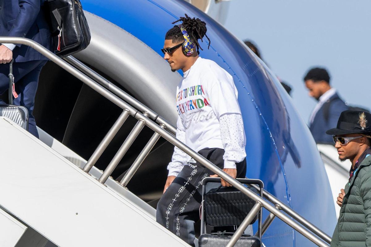 Kansas City Chiefs running back Isiah Pacheco boards a United Airlines flight with teammates from Kansas City International Airport on Sunday, Feb. 2, 2025, traveling to New Orleans for Super Bowl LIX.