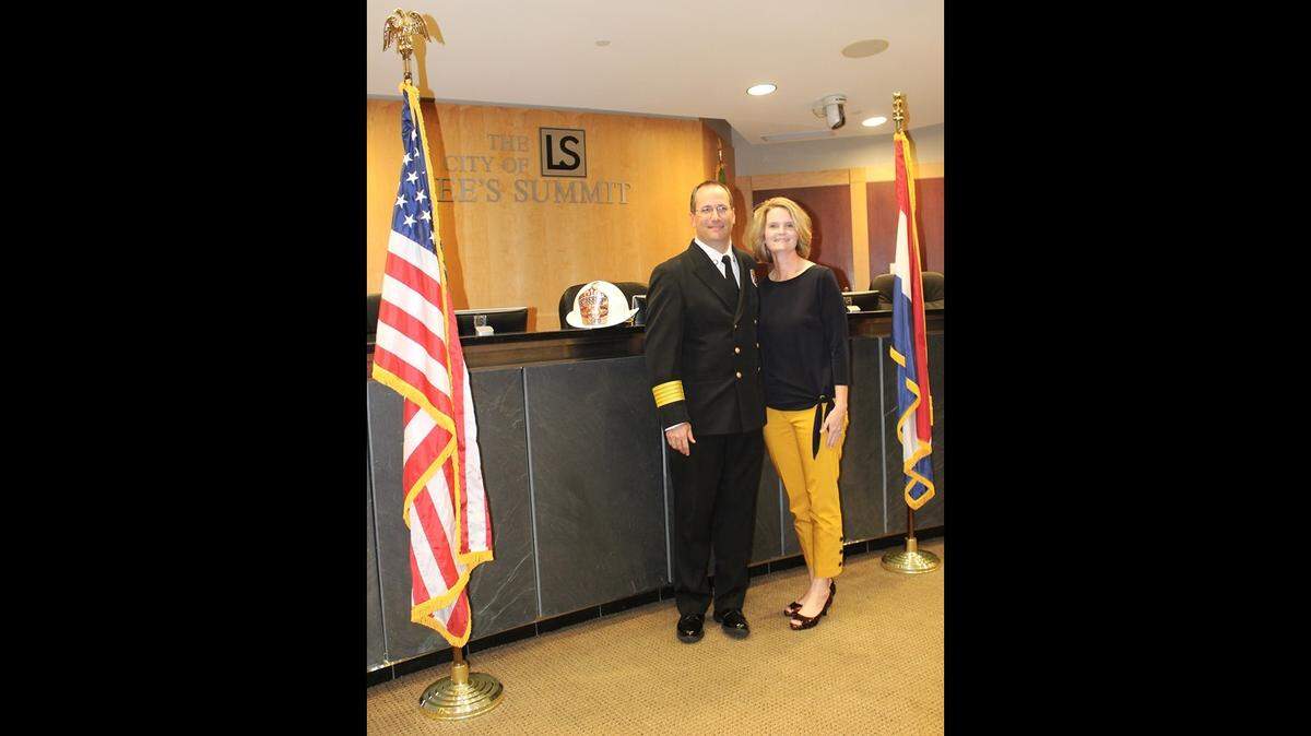 Chief Michael Snider, seen in here with his wife, Karrie, at an official swearing in ceremony in city council chambers, became the ninth fire chief of Lee’s Summit on Aug. 26. Snider replaces Chief Rick Poeschl, who retired in March.