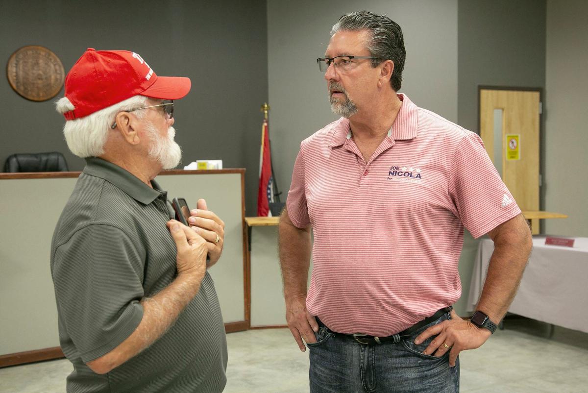Joe Nicola, a Jackson County pastor and Republican nominee for District 11 in the Missouri Senate, spoke with John Manley, of Sibley, Missouri, after an event focusing on a senior property tax freeze. The event was held Thursday, October 10, 2024 at Buckner City Hall.