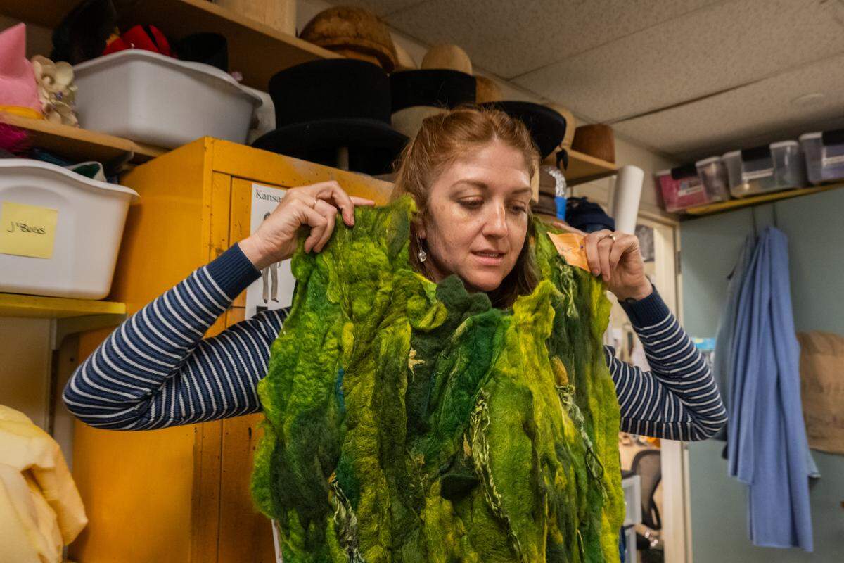 Joey Gee shows the design for the tree people in her craft room at the Spencer Theatre, in preparation for Kansas City Repertory Theater’s rendition of ‘The Wizard of Oz,’ on Tuesday, April 28, 2026.