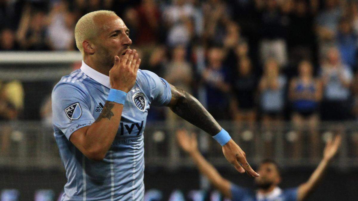 Sporting KC’s Yohan Croizet (left)