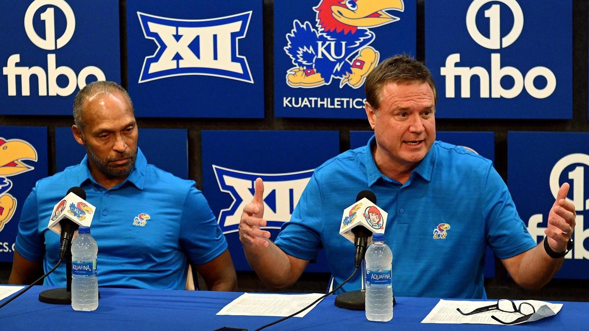 Kansas head basketball coach Bill Self, right, talks about his suspension from coaching the Jayhawks first four regular season games, during a press conference Thursday night after KU’s exhibition win over Pittsburg State. Assistant coach Norm Roberts, left, will take over the head coaching duties while Self is absent.