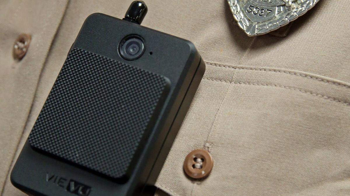 An officer wears a body camera.