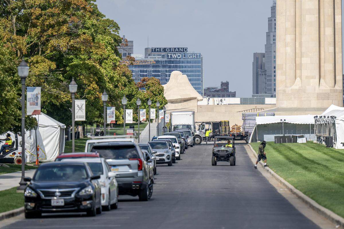 Event staffers set up tents, gates and other equipment outside the National WWI Museum and Memorial on Wednesday, Oct. 1, 2025, in Kansas City, ahead of pop singer Chappell Roan's concert Visions of Damsels and Other Dangerous Things.