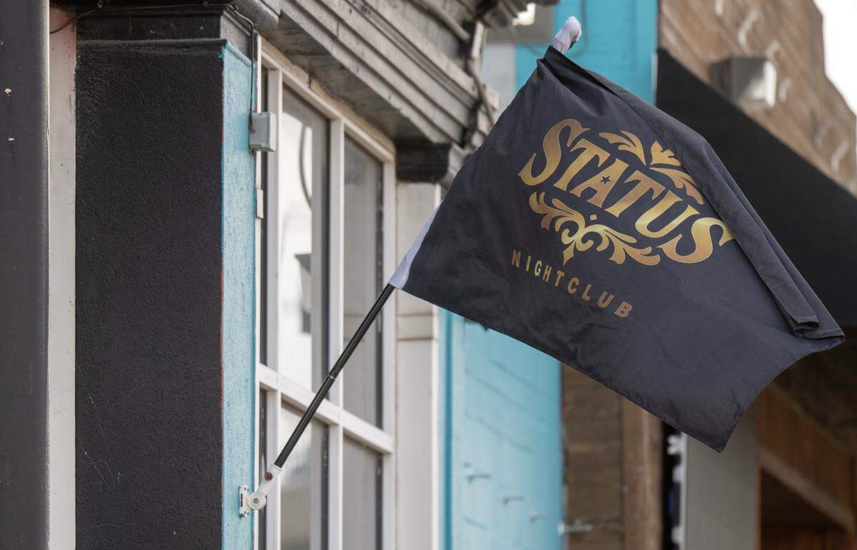 One day after a shooting left two women dead, a Status Nightclub flag flies outside the nightclub at 2801 Southwest Blvd., on Monday, Feb. 16, 2026, in Kansas City. Two women were fatally shot and two other people were injured in a shooting at the night club on Sunday, Feb. 15, 2026.