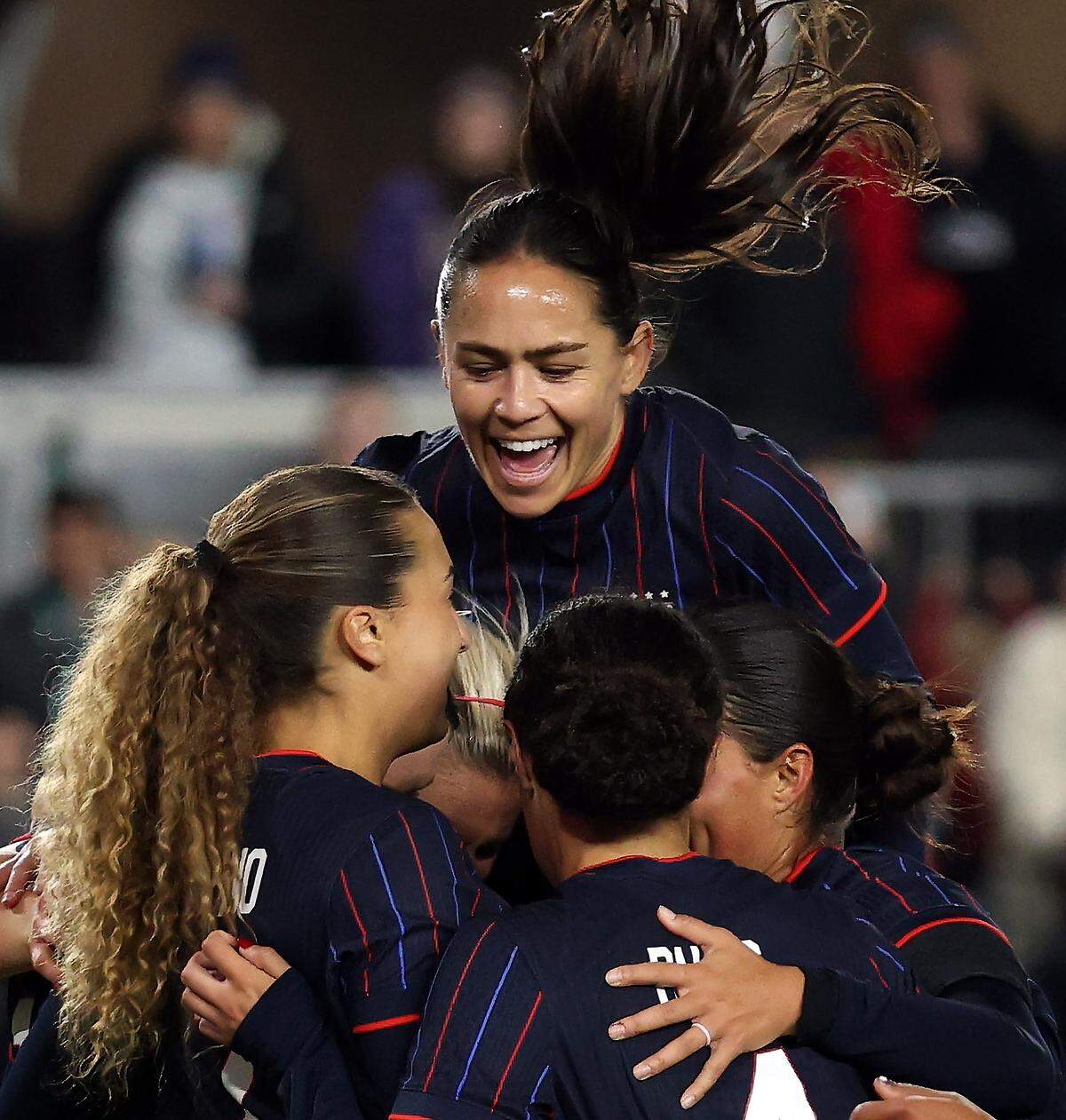Lo'eau LaBonta #11 of the United States celebrates with teammates after a goal during the second half of the match against New Zealand at CPKC Stadium on October 29, 2025 in Kansas City.