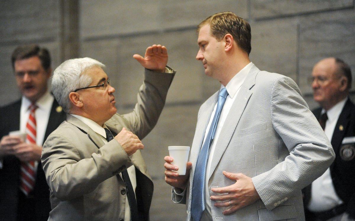 Sen. Tim Green, D-St. Louis, left, and Sen. Eric Schmitt, R-Kirkwood, confer in 2011 in the Senate Chamber in Jefferson City.