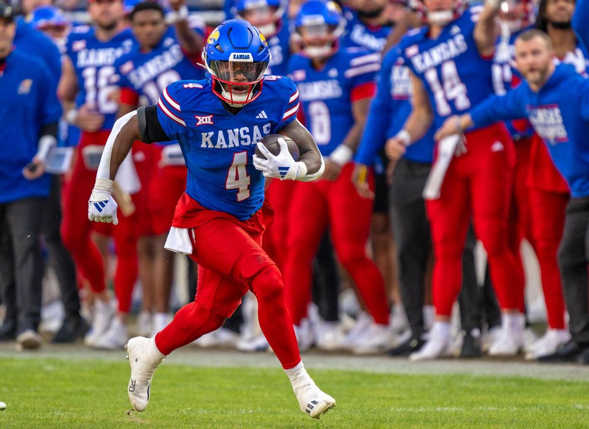 Kansas Jayhawks running back Devin Neal (4) runs for a long gain against the Colorado Buffaloes during the first half at GEHA Field at Arrowhead Stadium on Saturday, Nov. 23, 2024, in Kansas City.