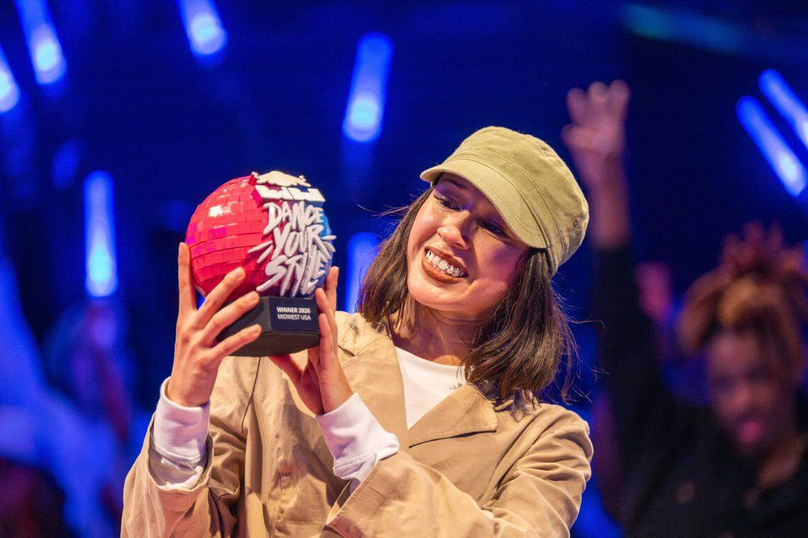 “Passion” holds the trophy after winning the final battle of the Red Bull Dance Your Style Midwest Regional Qualifier, on Saturday, April 25, 2026, at the Kauffman Center for the Performing Arts.