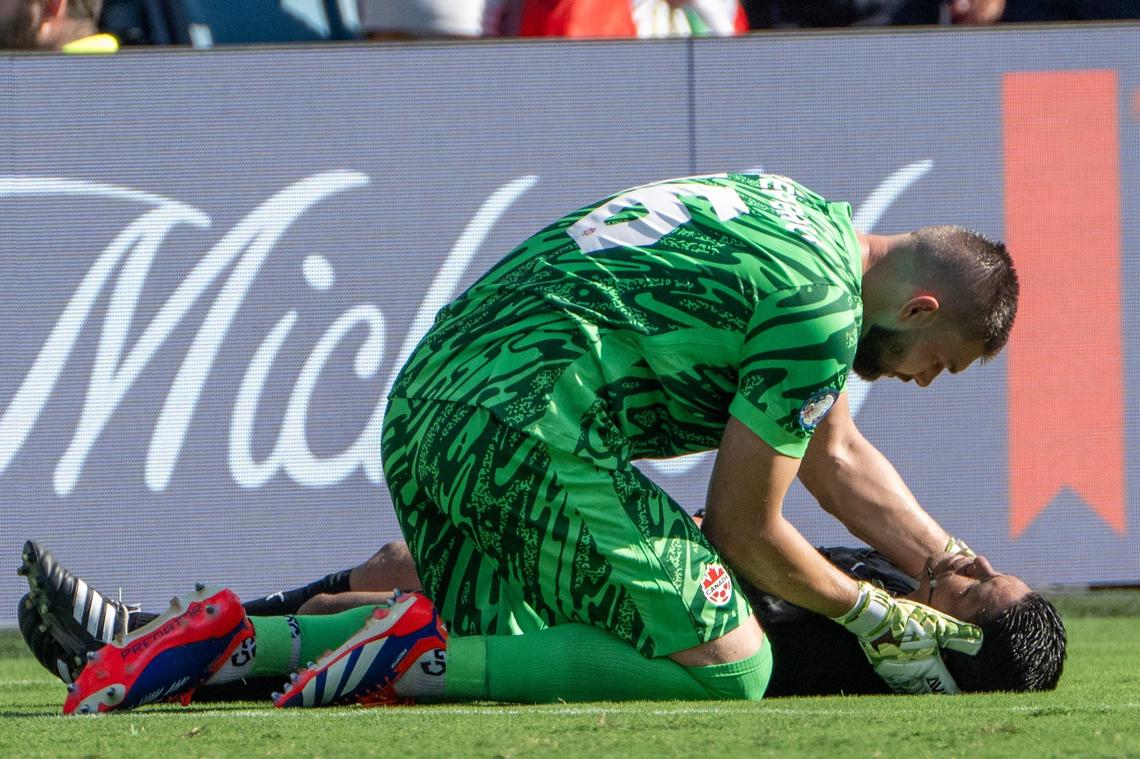 Canada goalkeeper Maxime Crépeau (16) attempts to help a referee who collapsed in the first half during a Copa America match between Canada and Peru at Children’s Mercy Park on Tuesday, June 25, 2024, in Kansas City, Kansas.