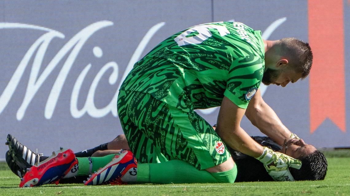 Canada goalkeeper Maxime Crépeau (16) attempts to help a referee who collapsed in the first half during a Copa America match between Canada and Peru at Children’s Mercy Park on Tuesday, June 25, 2024, in Kansas City, Kansas.