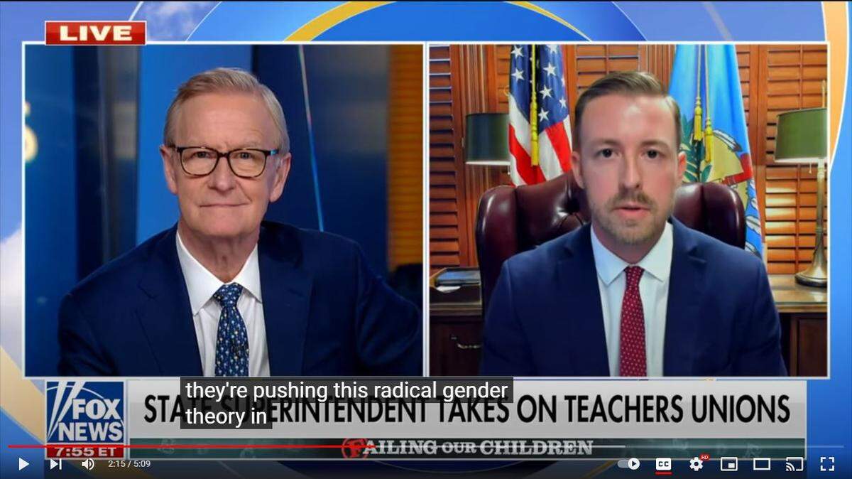 This image of Ryan Walters, Oklahoma superintendent of public instruction, right, was featured in a propaganda video he showed to the state Board of Education last week as part of his ongoing attacks on teachers unions. The video clip originated in an interview with Fox News host Steve Doocy.