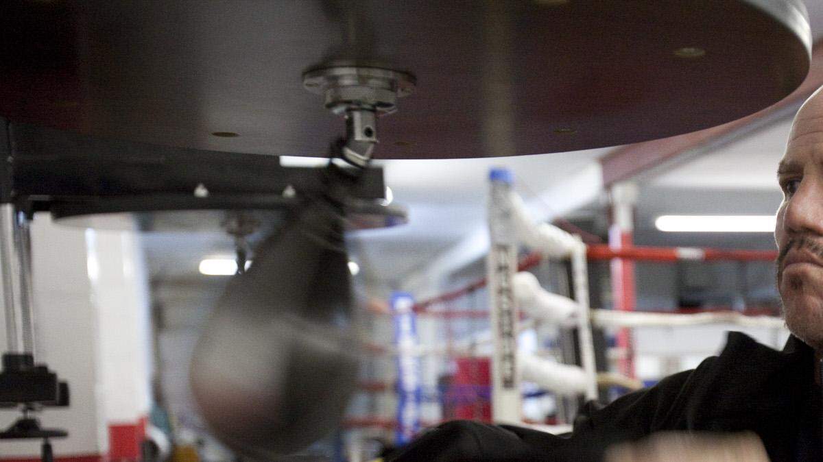 Former heavyweight boxing champion Tommy Morrison uses a speed bag a gym in south Wichita on Thursday. Morrison failed an HIV test before a 1996 heavyweight fight against Mike Tyson but now claims he doesn't have the virus. (Jan. 27, 2011)