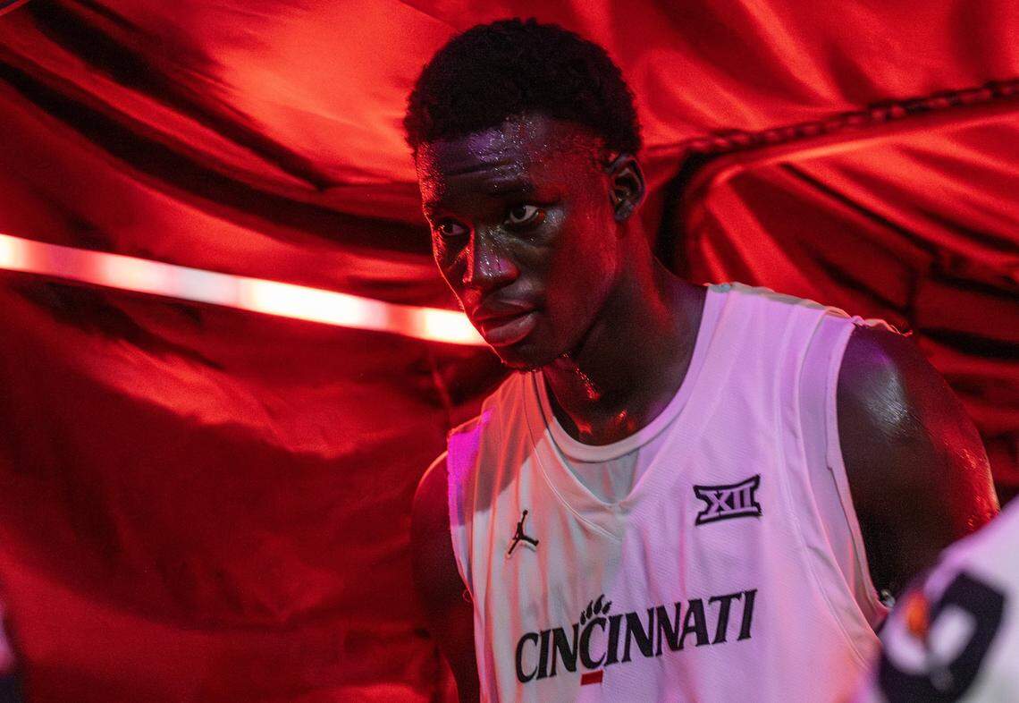 Cincinnati Bearcats center Moustapha Thiam (52) walks off the court through a red lit tunnel after defeating Utah Utes 73-66 in a Big 12 Men's Basketball Tournament at T-Mobile Center on Tuesday, March 10, 2026, in Kansas City.