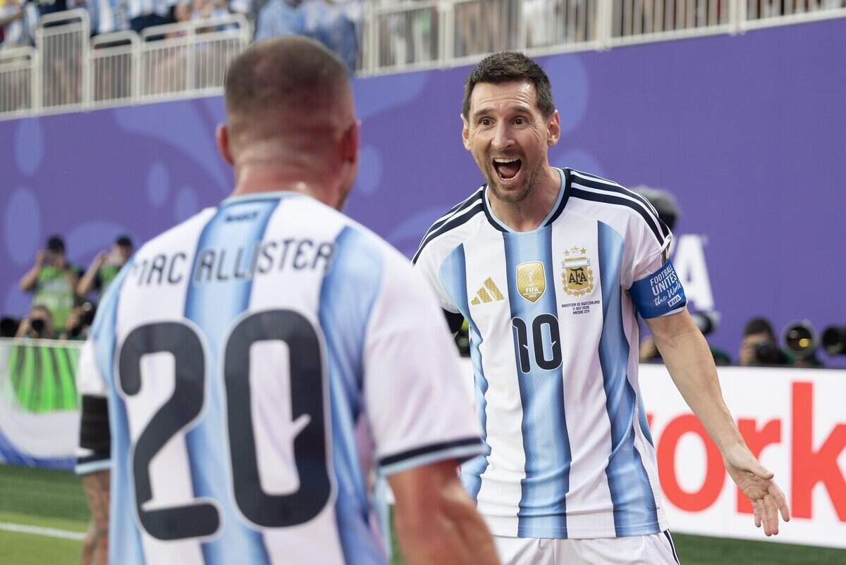 Argentina forward Lionel Messi (10) celebrates with teammate Argentina midfielder Alexis Mac Allister (20) after Messi kicked a corner that Mac Allister converted to a goal during the FIFA World Cup quarterfinal match at Kansas City (Arrowhead) Stadium in Kansas City on Saturday, July 11, 2026.