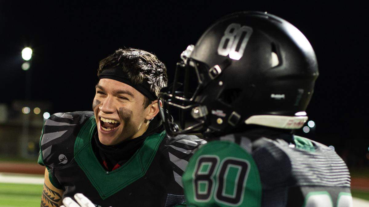 Koa Grace, left, celebrates with Staley teammate Alex Miller after the Falcons defeated North Kansas City, 21-3, Friday night at the North Kansas City District Activities Complex. The win gave the Falcons the Missouri Class 5, District 8 title.