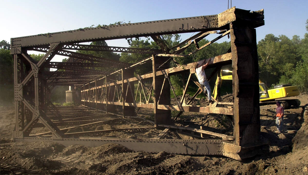The original Sharp’s Station Bridge, a 326-foot steel truss structure, was dismantled in 2002 to make way for a new concrete span over the Platte River.