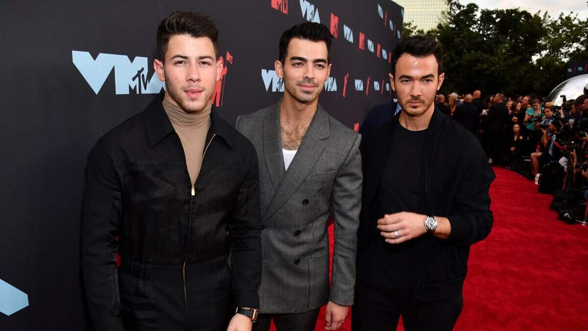 Nick Jonas, from left, Joe Jonas and Kevin Jonas, of the Jonas Brothers, at the MTV Video Music Awards in Newark, N.J. in 2019. The brothers were expected to make an appearance at the NFL Draft in Kansas City on Thursday.