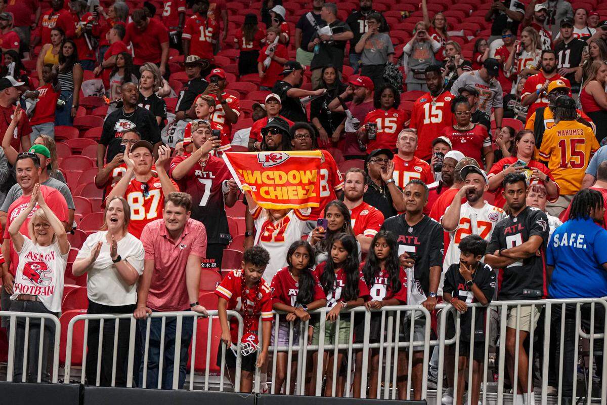 Kansas City Chiefs fans react after the Chiefs defeated the Atlanta Falcons at Mercedes-Benz Stadium.