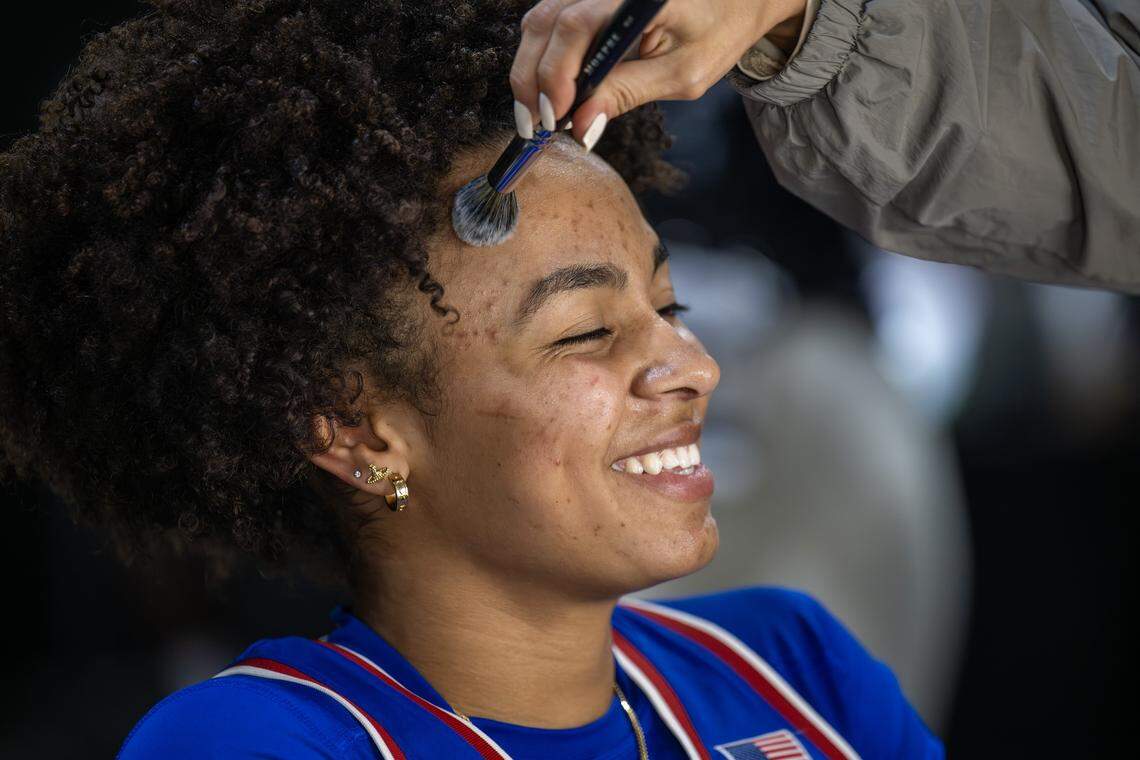 Kansas Jayhawks forward Jaliya Davis (25) has her makeup retouched at the Sports Illustrated Swimsuit beauty bar after interviews during Big 12 Media Days at T-Mobile Center on Tuesday, Oct. 21, 2025, in Kansas City.