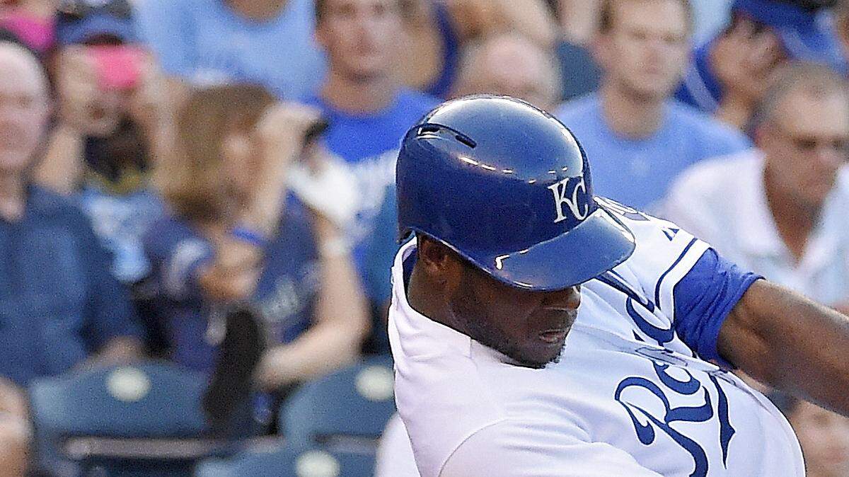 The Royals' Lorenzo Cain connects on a triple in the first inning during Friday's baseball game against the White Sox at Kauffman Stadium .