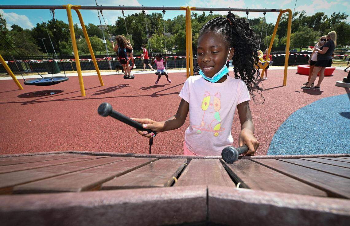 Laylah Reed, 7, of Kansas City, played a music attraction at the 15 and the Mahomies Playground at Martin Luther King, Jr. Park on Saturday, Aug. 28, 2021, at Dr. Martin Luther King, Jr. Blvd. & Woodland Ave., in Kansas City. Chiefs quarterback’s Patrick Mahomes foundation, 15 and the Mahomies Foundation donated $1 million to help transform the park making it accessible for children of all abilities.