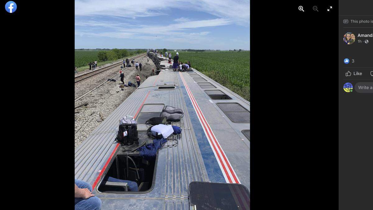 Several passenger cars of an Amtrak train rested on their sides after the train crashed into a truck at a crossing near Mendon, Missouri.