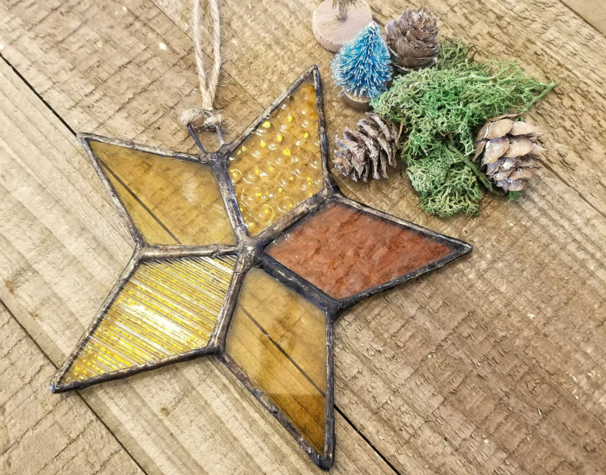 This stained glass star ornament is made by Lost and Found Designs, a Kansas City based stained glass artist and member of Cherry Pit Collective.