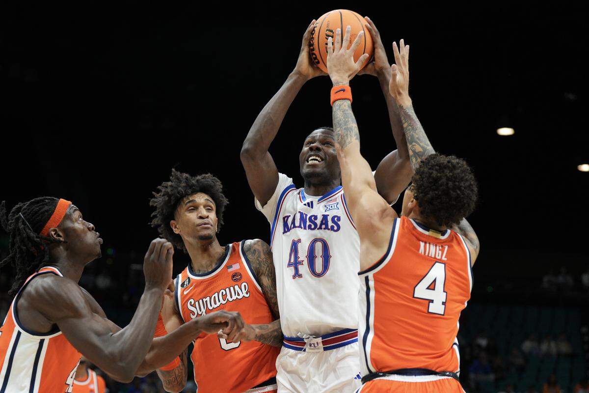 Flory Bidunga #40 of the Kansas Jayhawks shoots against Nate Kingz #4 of the Syracuse Orange in the first half of their game during the Players Era Championship basketball tournament at Grand Garden Arena on November 25, 2025 in Las Vegas.