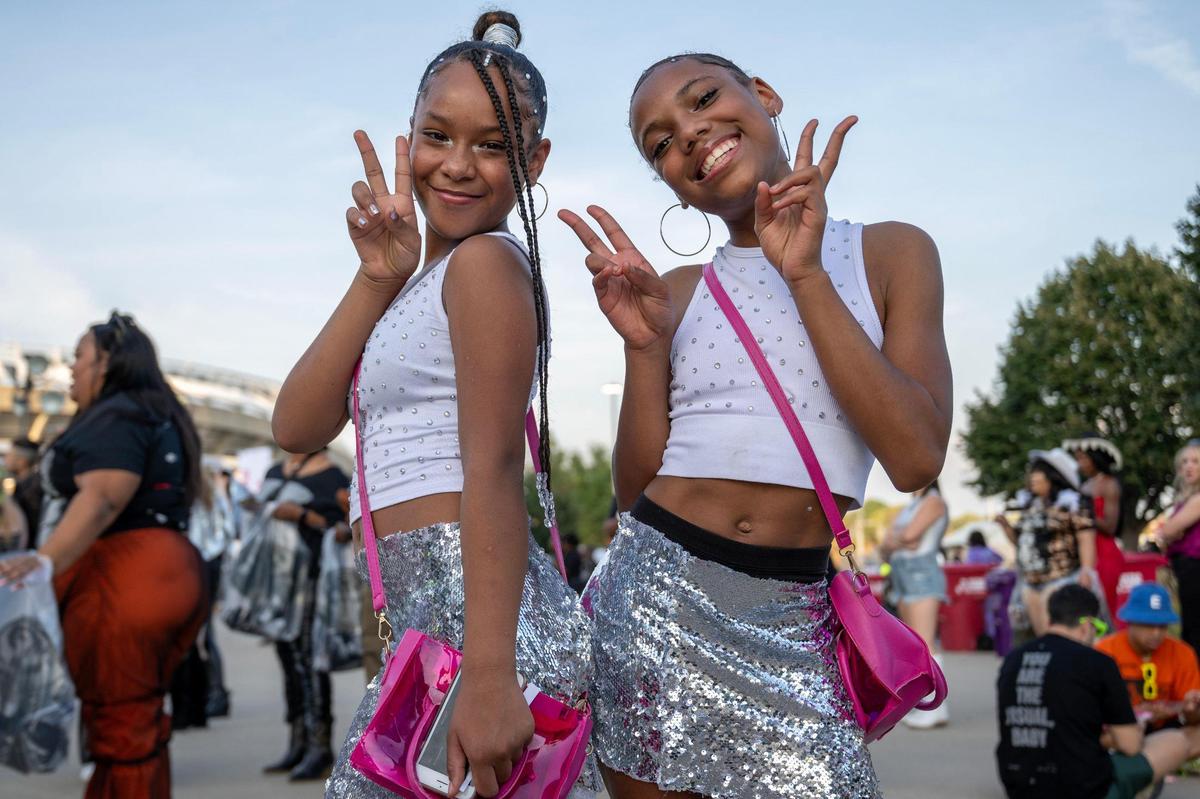 Ten-year-old Eulydia Parks, left, and 12-year-old Cashmere Ashby pose for a photo while waiting in line to attend the last stop of Beyoncé’s Renaissance World Tour at GEHA Field at Arrowhead Stadium on Sunday, Oct. 1, 2023, in Kansas City.