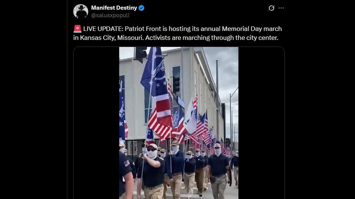 Members of the white nationalist Patriot Front organization march in downtown Kansas City on Saturday.