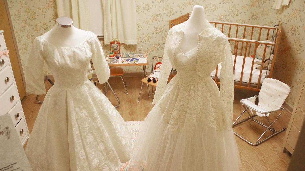 The Johnson County Museum’s new exhibit, ‘The White Wedding: A New Postwar Tradition,’ features various wedding dresses worn by local brides from the late 1940s to the early 1960s.