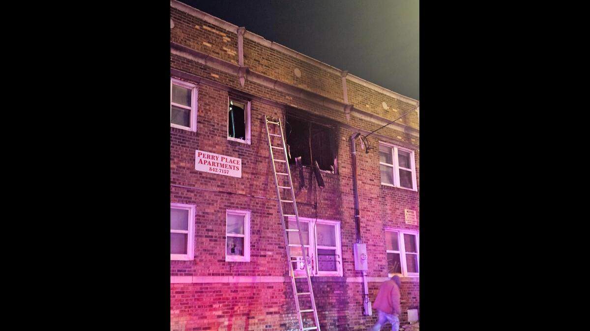 Firefighters responded to Perry Place Apartments, 1027 E 9th Street, on Nov. 12, 2024 to put out a blaze that appeared to be coming from the second story. No injuries were reported in the fire, but 16 people have been displaced.