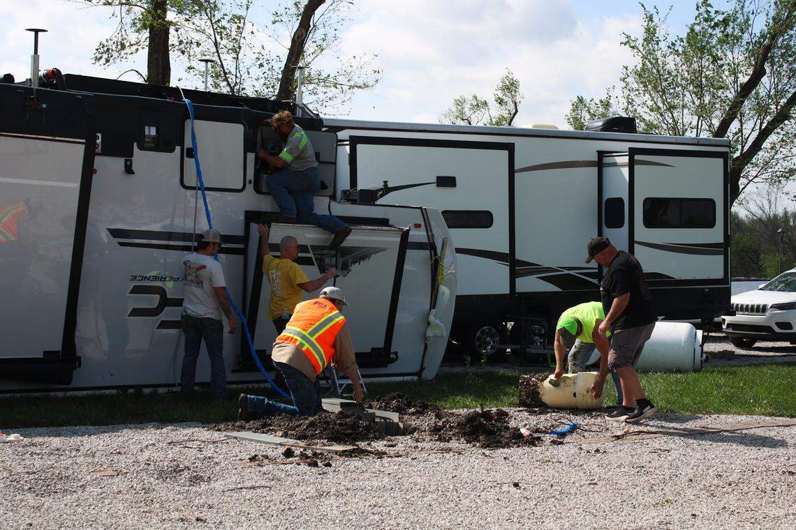 Crews work on water lines at Shady Acres RV Park after a tornado ripped through the Hillsdale community Monday night.
