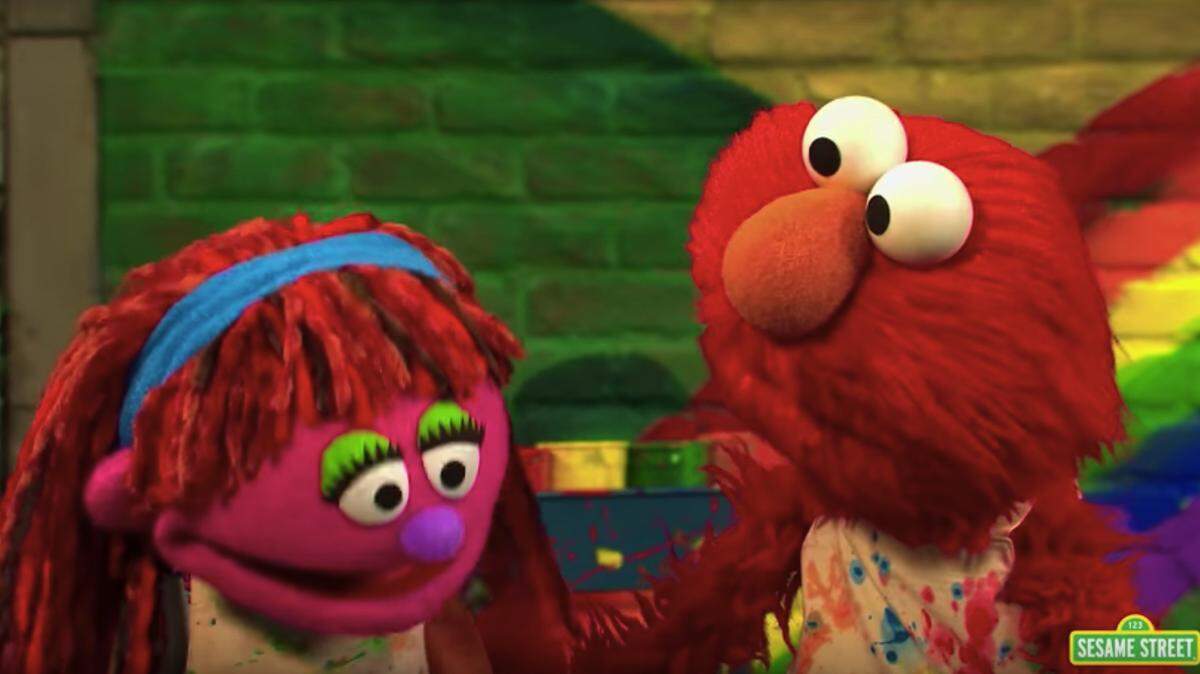 Lily, left, a Muppet first introduced on “Sesame Street” in 2011 to discuss food insecurity, is back, and this time she and her family are homeless. She will star in a series of videos that address the nation’s homeless problem. (Sesame Street video screengrab)