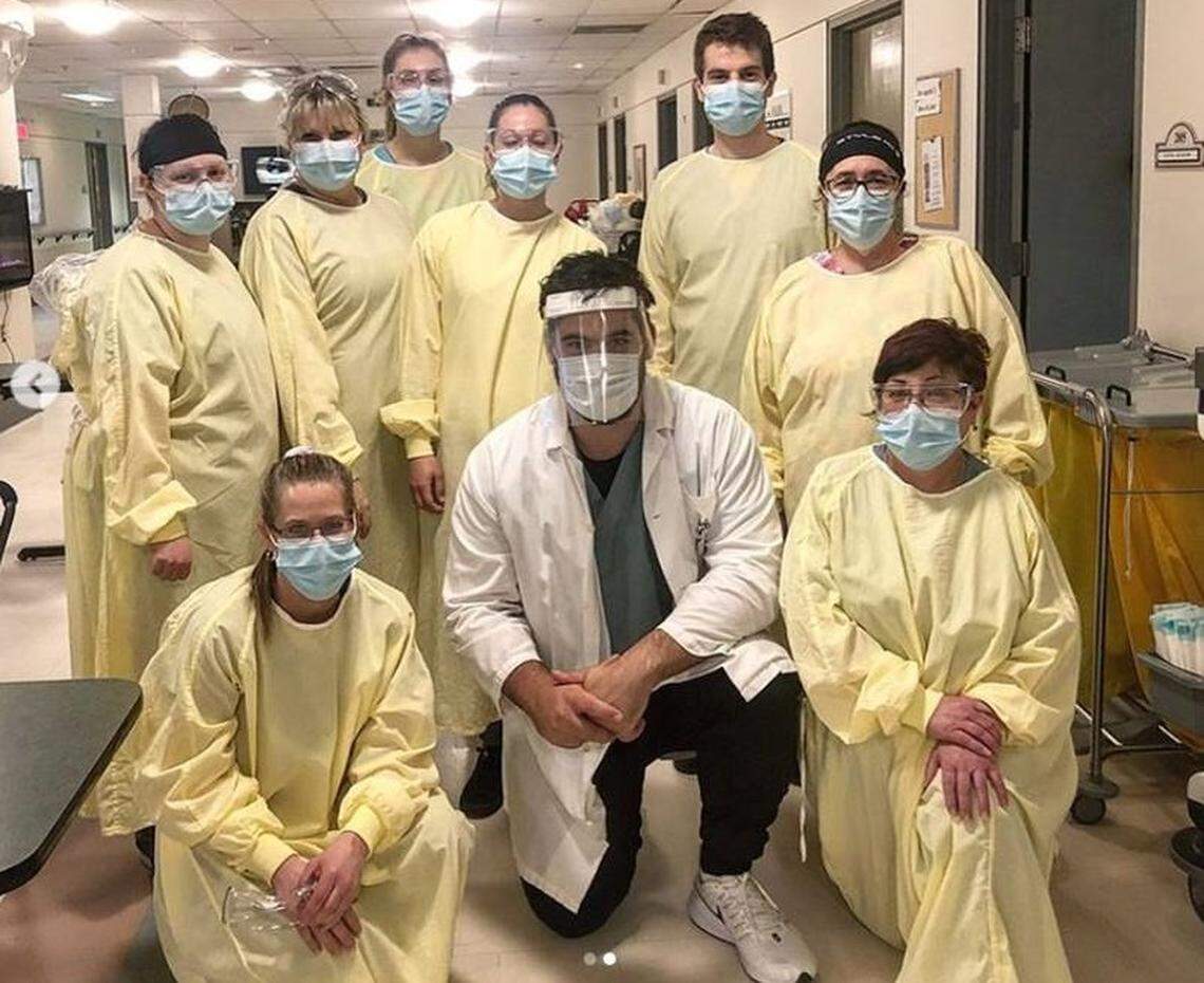Chiefs lineman Laurent Duvernay-Tardif, center, in white lab coat, opted out this season to fight on the front lines against COVID-19 in his native Canada, but he’s still watching his team closely.