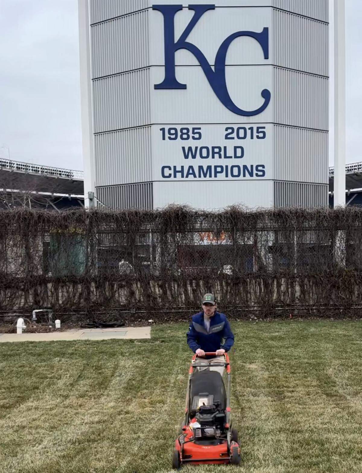 The owner of SB Mowing working on the grass at Kauffman Stadium.