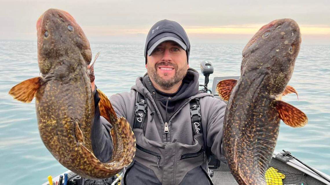 The fisherman was out on Lake Michigan near Portage when he reeled in a “rare,” record-breaking fish. Then he caught another, photos show.