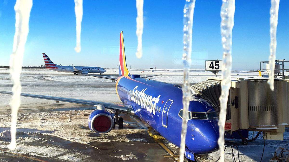 FILE PHOTO. Ice hangs from the windows at Kansas City International Airport.