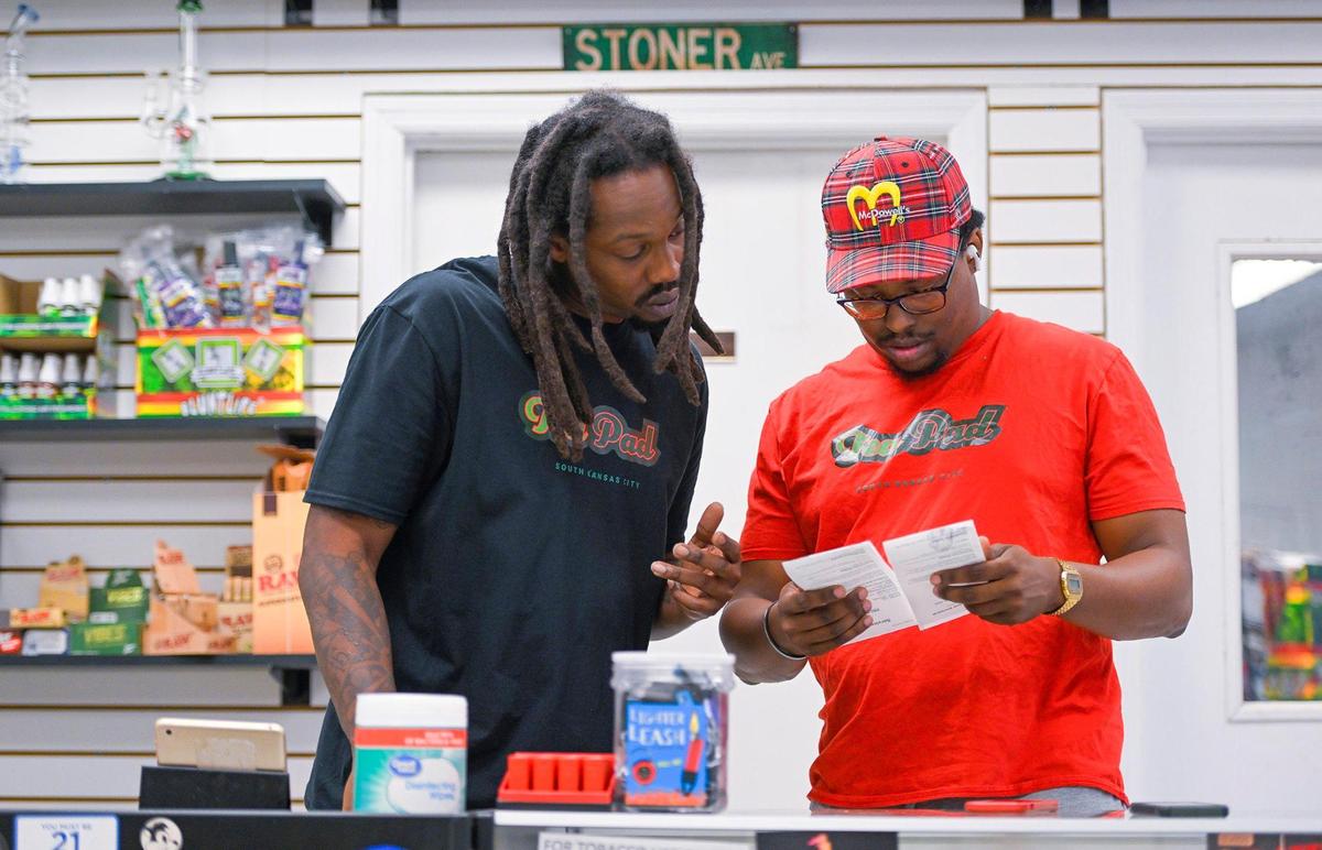 Roderick Pearson Jr., left, and Andrew McDowell, shared a laugh outside of The Funky Skunk, a retail smoke shop that sells CBD, helps patients get medical marijuana cards and and hosts marijuana-smoking events.