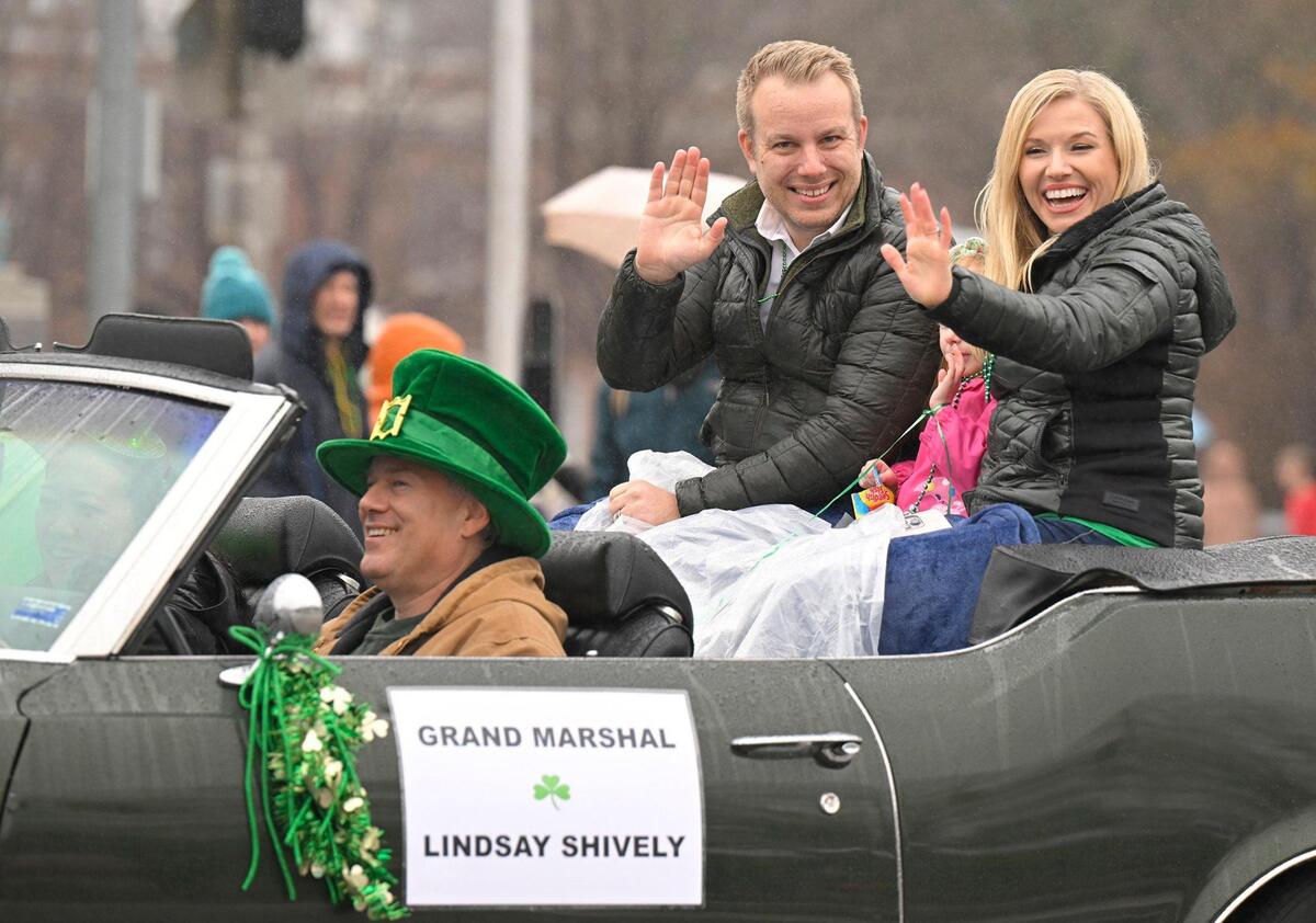 Rain didn’t dampen the festivities during the 2023 Brookside St. Patrick’s Day Warm-Up Parade where Grand Marshall Lindsay Shively accompanied by her husband, Sebastian De Geer, waved to the crowd on Saturday March 11, 2023 in Kansas City.