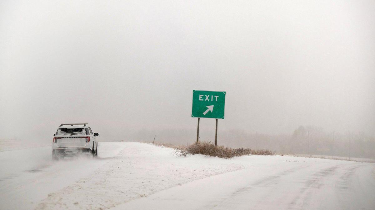 Snow-packed roads and blizzard conditions were slowing a driver heading westbound Kansas 10 Highway on Sunday, Jan. 5, 2025, in western Lenexa.