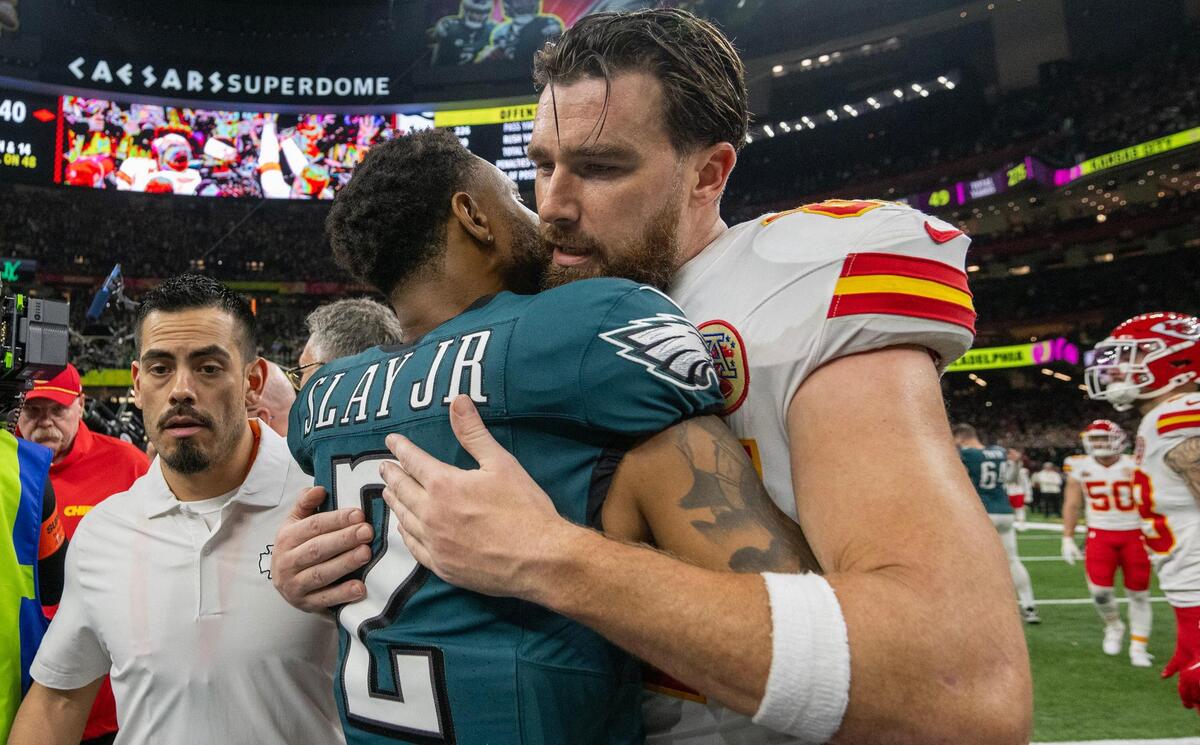Kansas City Chiefs tight end Travis Kelce (87) hugs Philadelphia Eagles cornerback Darius Slay Jr. (2) after Chiefs lost to the Philadelphia&nbsp;Eagles, 40-22, in Super Bowl LIX on Sunday, Feb. 9, 2025, in New Orleans.