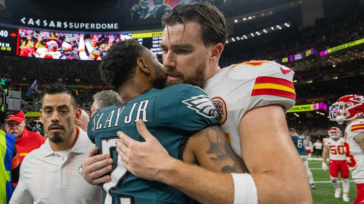 Kansas City Chiefs tight end Travis Kelce (87) hugs Philadelphia Eagles cornerback Darius Slay Jr. (2) after Chiefs lost to the Philadelphia Eagles, 40-22, in Super Bowl LIX on Sunday, Feb. 9, 2025, in New Orleans.