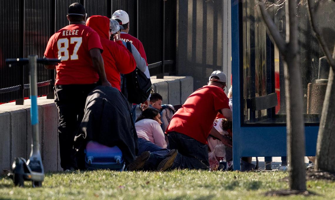 People take cover after a shooting broke out following the Kansas City Chiefs Super Bowl LVIII victory parade on Wednesday, Feb. 14, 2024, in Kansas City.