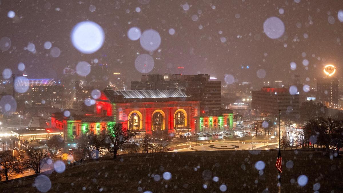 The first snow of the season falls over the Kansas City skyline on Saturday, Nov. 25, 2023, in Kansas City.